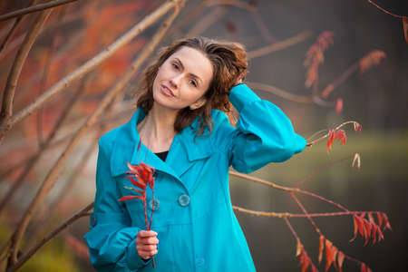young girl in autumn parkの写真素材