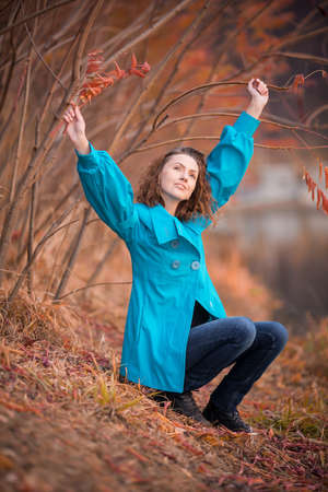 young girl in autumn parkの写真素材