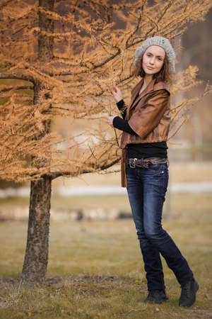young girl in autumn parkの写真素材