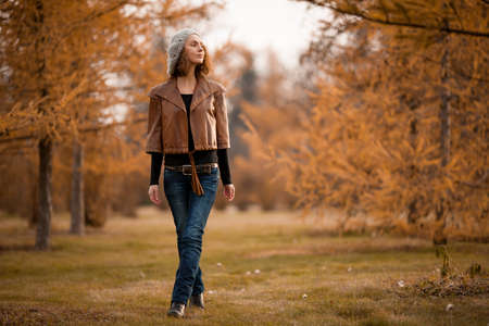 young girl in autumn parkの写真素材