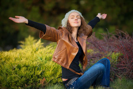 young girl in autumn parkの写真素材