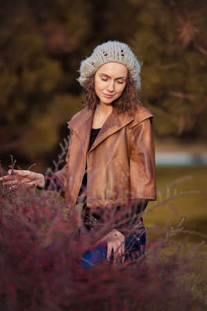 young girl in autumn parkの写真素材