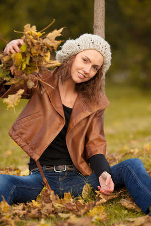 young girl in autumn parkの写真素材