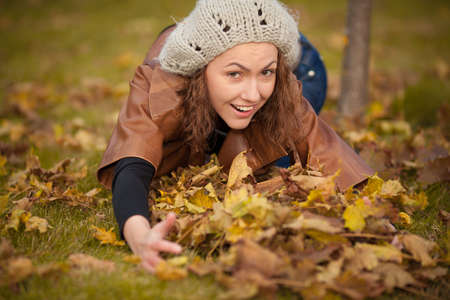 young girl in autumn parkの写真素材