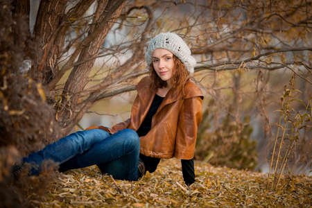 young girl in autumn parkの写真素材