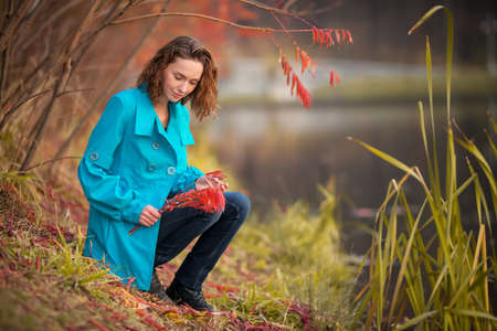 young girl in autumn parkの写真素材