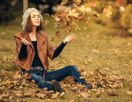 young girl in autumn parkの写真素材