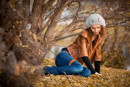 young girl in autumn parkの写真素材