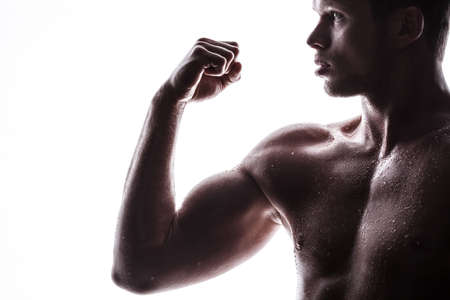 Handsome athlete on a white backgroundの写真素材