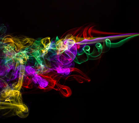 Abstract smoke  colored smoke on a black backgroundの写真素材
