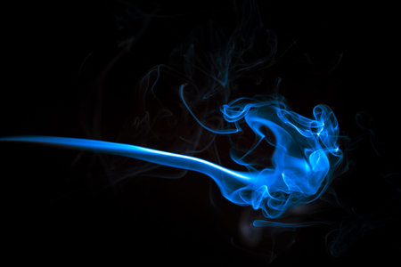 Blue smoke in the black abstract backgroundの写真素材