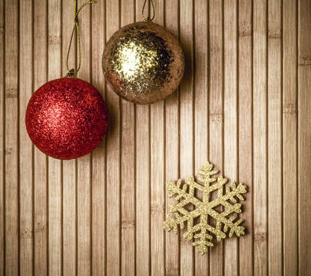 Christmas background with balls and decorations over wooden tableの写真素材
