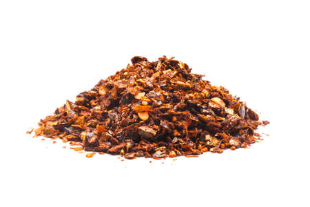 Dried red pepper flakes, isolated on white の写真素材