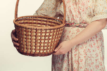 girl holding a basket. nice vintage styleの写真素材