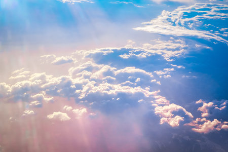 Sunrise above clouds during a flight bright light and colors