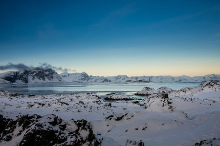 Beautiful snow-capped mountains against the sunset sky in Antarctica