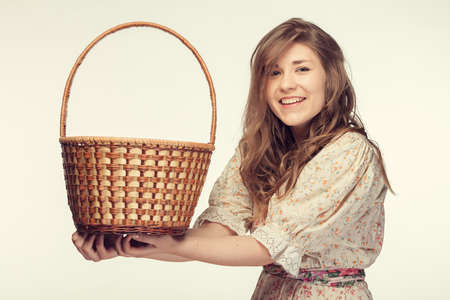Happy smiling beautiful healthy girl with basketの写真素材