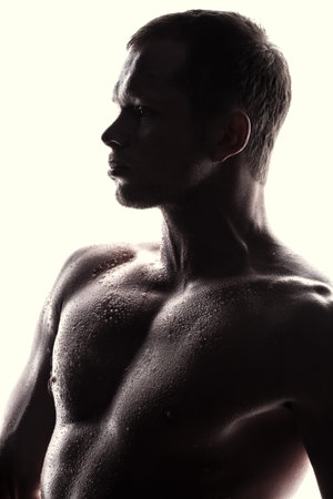 Handsome athlete on a white の写真素材