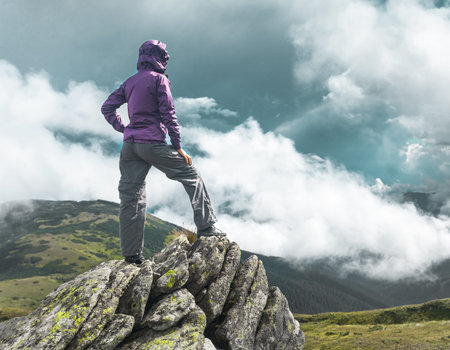 Woman standing on top of a mountain. Carpathians, Ukraineの写真素材