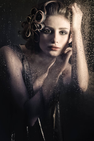beautiful young woman behind the window