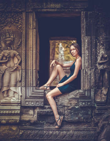Girl posing in Angkor Wat Temple, Cambodiaの写真素材