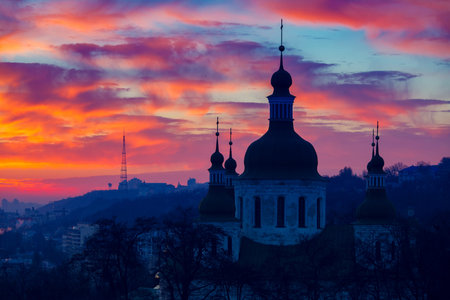 Orange sunset and cloud over cityscape Kiev, Ukraine, Europe