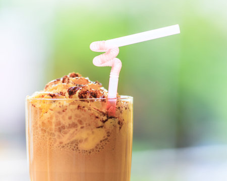 Glass of chocolate milkshake with whipped cream