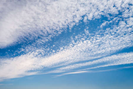 Blue sky with white clouds backgroundの写真素材