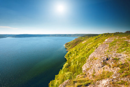 Beautiful river landscape and sunshine in Bakota, Ukraineの写真素材