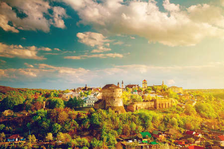 Kamianets Podilskyi cityscape under sunshine and colorful skyの写真素材