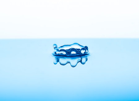 Close up abstract water drops splash on blue background