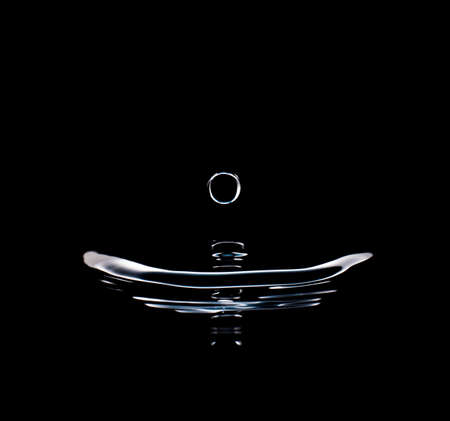 Close up water drops splash on black backgroundの写真素材