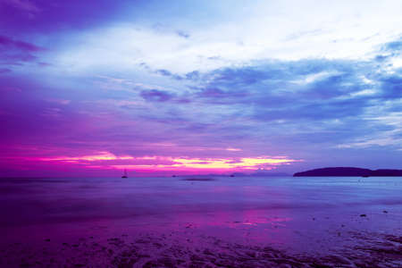 landscape of tropical beach and colorful sky at sunset in Krabi province, Thailandの写真素材