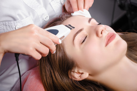 Young woman getting skin cleaning at beauty salon