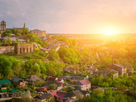 Kamianets Podilskyi cityscape under sunshine and colorful skyの写真素材