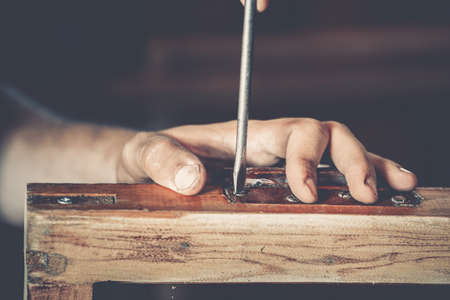 male carpenter at work close upの写真素材