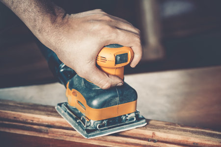 male carpenter at work close upの写真素材
