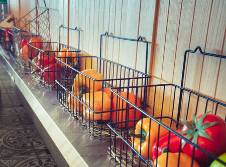 Plastic vegetables in boxes. Modern restaurant Interior designの写真素材