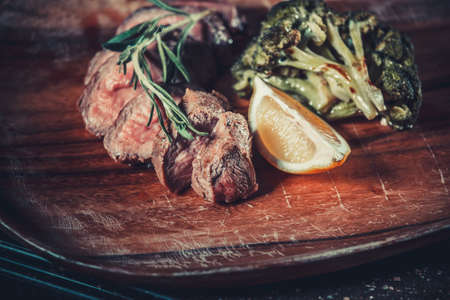 Delicious appetizer with herbs on wooden table close upの写真素材