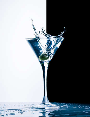classic contemporary cocktail with splashes on black and white backgroundの写真素材