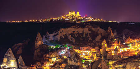 Ancient town and castle of Uchisar dug mountains, Cappadocia at night, Turkeyの写真素材