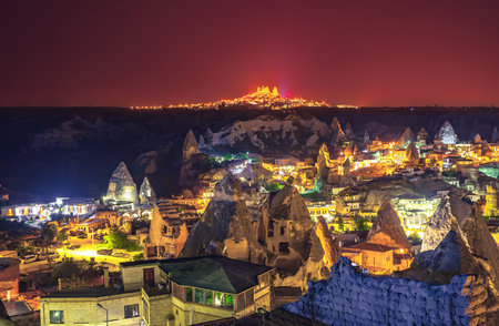 Ancient town and castle of Uchisar dug mountains, Cappadocia at night, Turkeyの写真素材