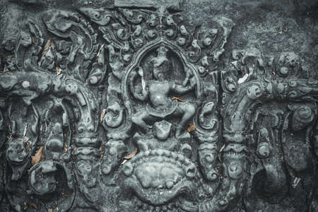 Ancient decorative sculpture on wall in Angkor Wat, Cambodiaの写真素材