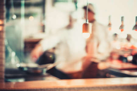 Blurred background : Group of chefs cooking in the kitchenの写真素材