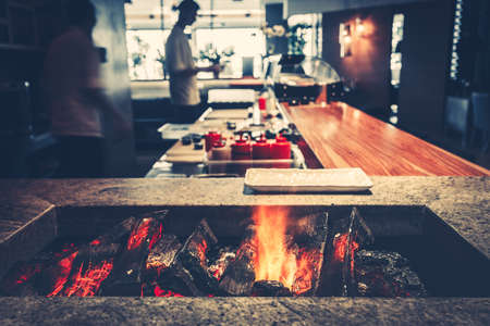 Interior of modern restaurant with fireplace close-upの写真素材