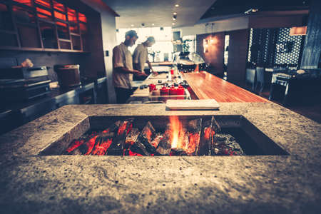 Interior of modern restaurant with fireplace close-upの写真素材