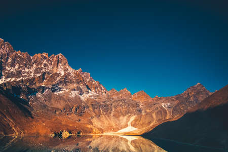 Himalaya Mountain landscape. Dudh pokhari Gokyo lake and Phari Lapche peak at sunrise - Gokyo - Way to Cho Oyu Base Camp - Nepal. Beautiful nature landscape. Travel background.の写真素材