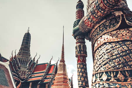 Demon Guardian close up in Royal Grand King Palace in Bangkok, Thailand. Beautiful Landmark of Asia, architecture, mosaic decoration. Landscape of the capital city. Travel background. Place to visitの写真素材