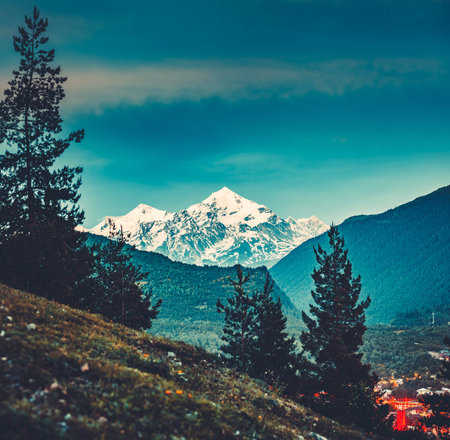 Majestic view from the green valley to the mighty snow-capped Caucasus Mountains in Georgia....