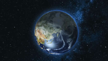 Realistic Earth Planet, rotating on its axis in space against the background of the Milky Way star sky. Astronomy and science concept. Continents and oceans.の写真素材